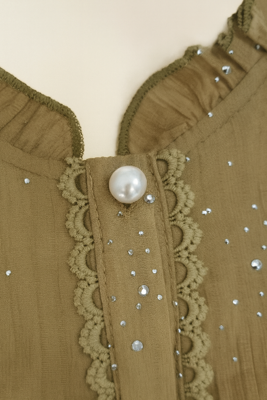 Аёллар кўйлаги тугмаси