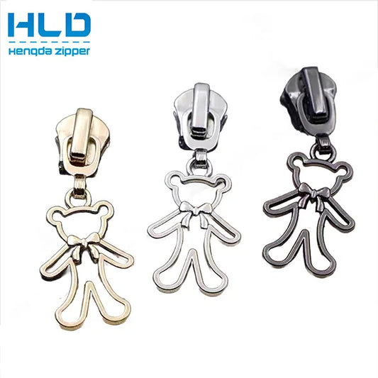 Ҳенгда фабрикаси мослаштирилган мултфилмли фермуарни тортиб олиш боши аксессуарлари Кийим учун металл слайдер Юқори сифатли қотишма фермуар мослаштирилган